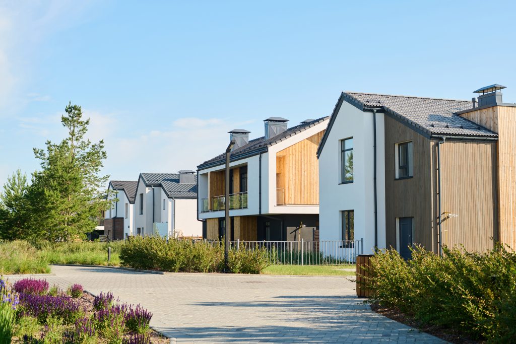 Perspective view of modern two storey village houses with front yards